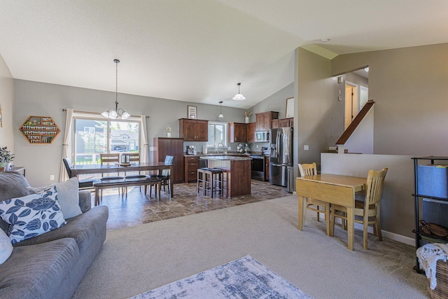 living room with carpet, sink, lofted ceiling, and a chandelier