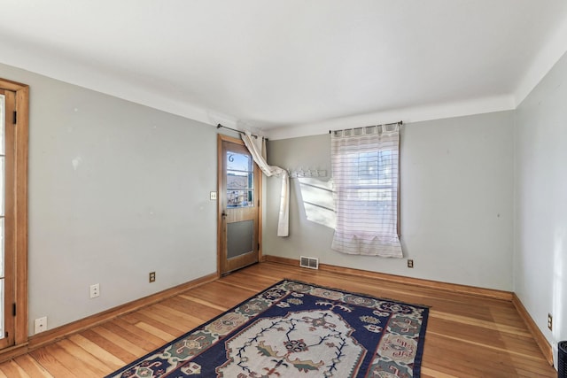 unfurnished room featuring light wood-type flooring