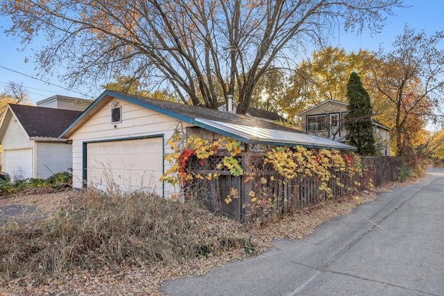 view of property exterior with a garage