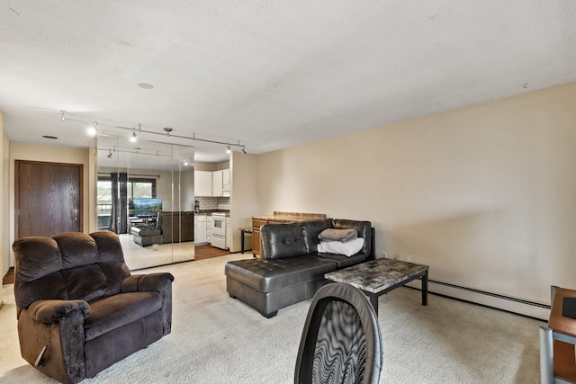 carpeted living room featuring rail lighting, a textured ceiling, and baseboard heating