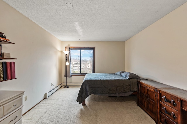 bedroom with baseboard heating, light carpet, and a textured ceiling