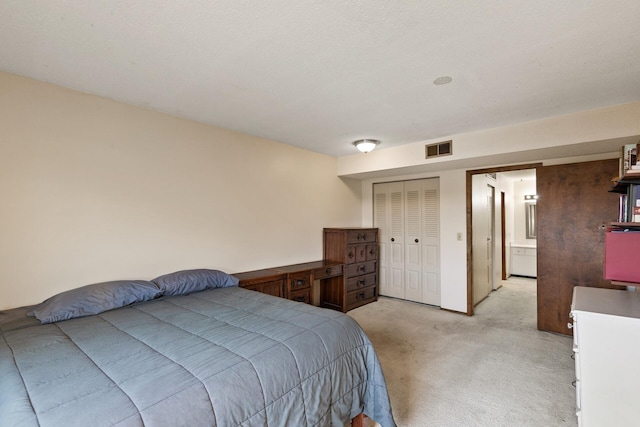 carpeted bedroom with a closet