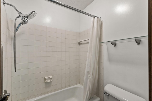 bathroom featuring toilet and shower / bath combo