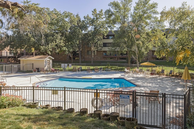 view of swimming pool featuring a patio area