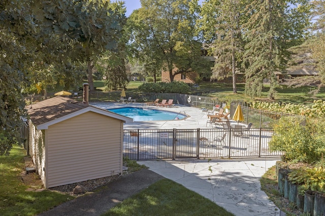 view of swimming pool with a patio