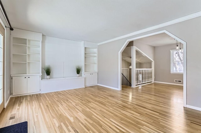 bonus room featuring wood finished floors, visible vents, and baseboards