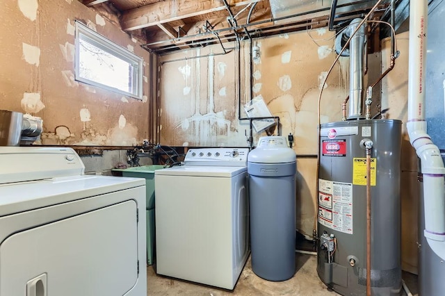 washroom with laundry area, water heater, and washer and clothes dryer