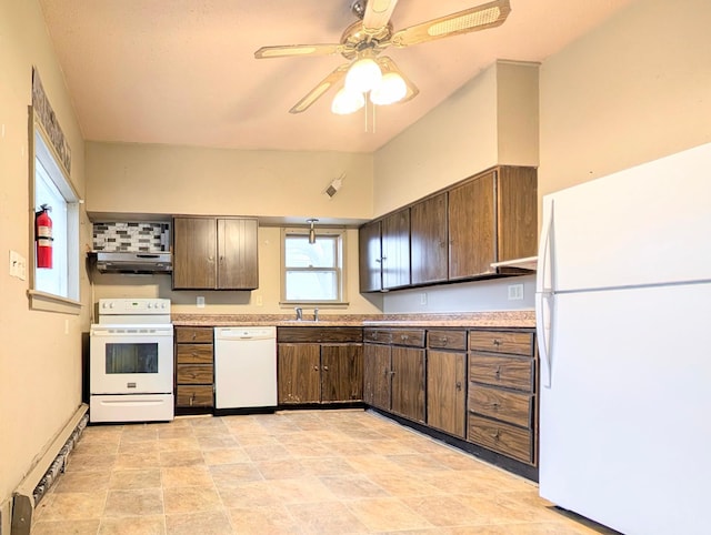 kitchen featuring dark brown cabinetry, sink, white appliances, and a baseboard radiator