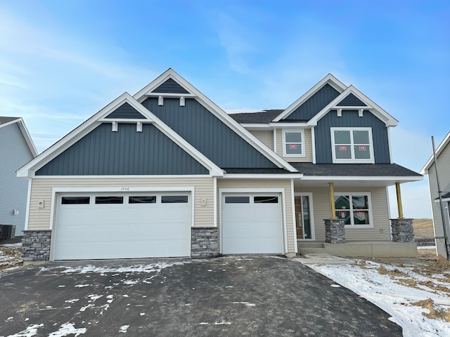 craftsman-style home with cooling unit and covered porch