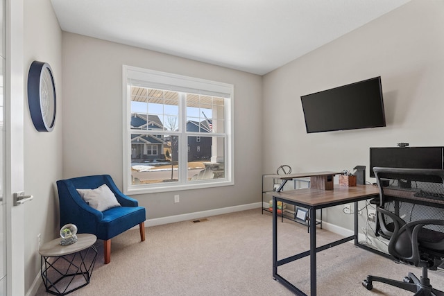 office with carpet flooring, visible vents, and baseboards