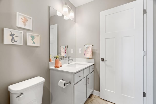 half bath with vanity, toilet, and marble finish floor