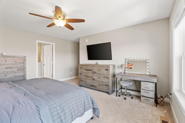 bedroom featuring visible vents, carpet floors, baseboards, and a ceiling fan