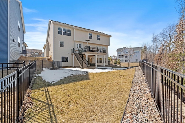 back of house featuring a patio area, stairway, a yard, and a fenced backyard