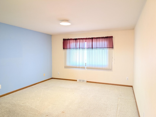 unfurnished room featuring carpet floors