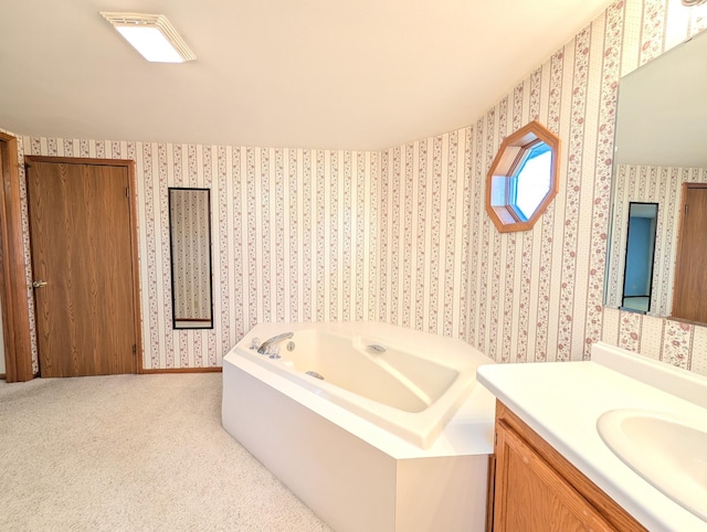 bathroom with vanity and a tub to relax in