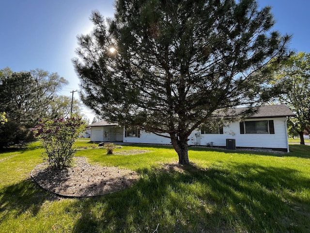 501 Lac Qui Parle Ave N, Canby, MN 56220 - view of grassy yard featuring central AC