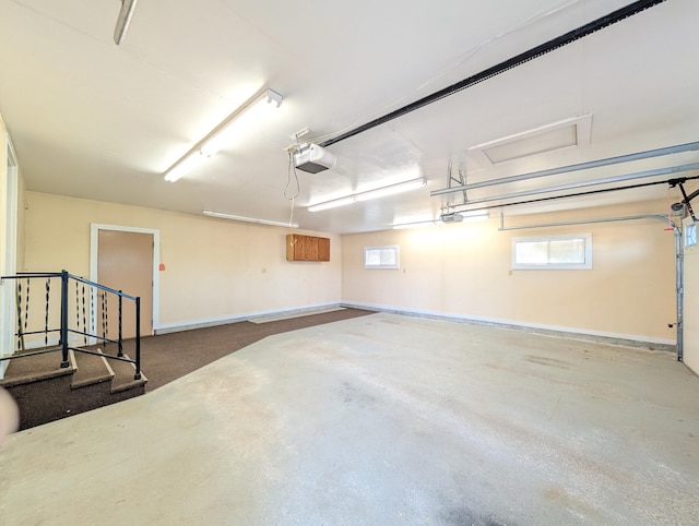 501 Lac Qui Parle Ave N, Canby, MN 56220 - garage featuring a garage door opener and baseboards
