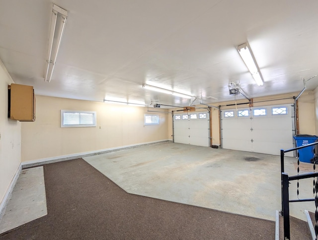 501 Lac Qui Parle Ave N, Canby, MN 56220 - garage with baseboards and a garage door opener