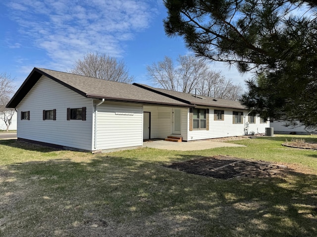 501 Lac Qui Parle Ave N, Canby, MN 56220 - back of house featuring a lawn, roof with shingles, and entry steps