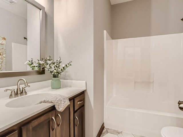 full bathroom featuring vanity, shower / washtub combination, tile patterned floors, and toilet