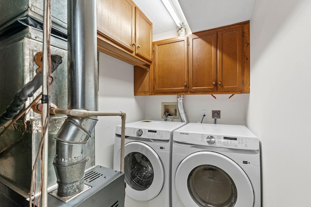 10 94th Cir NW Unit 201, Coon Rapids, MN 55448 - laundry room featuring cabinet space and washer and clothes dryer
