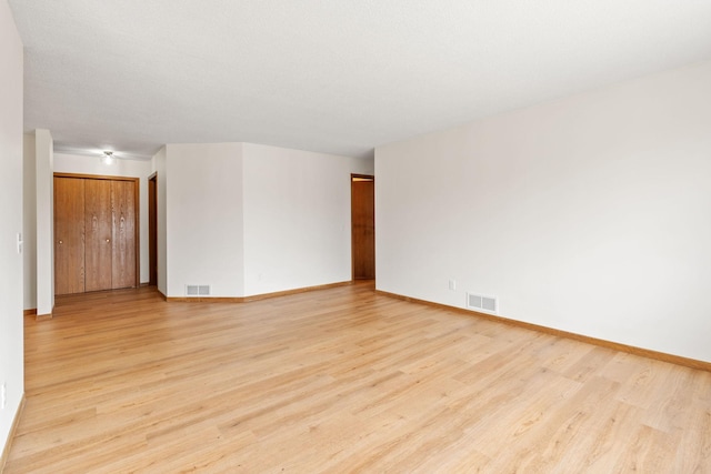 10 94th Cir NW Unit 201, Coon Rapids, MN 55448 - spare room featuring light wood-style floors and baseboards