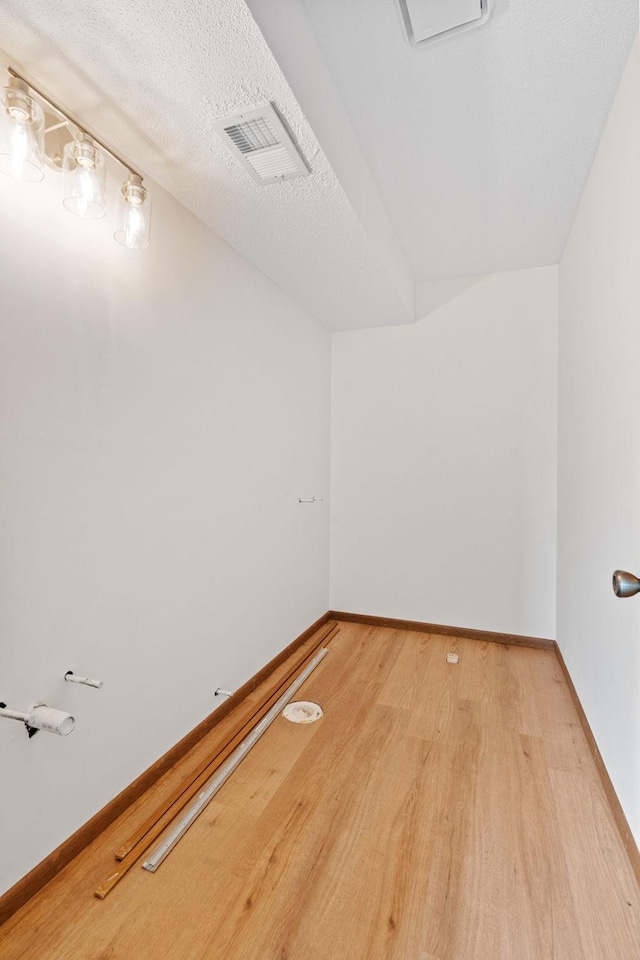 10 94th Cir NW Unit 201, Coon Rapids, MN 55448 - unfurnished room featuring light wood-style flooring and baseboards