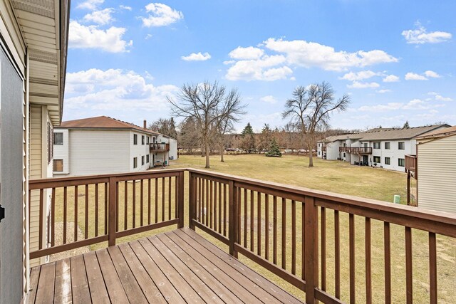 10 94th Cir NW Unit 201, Coon Rapids, MN 55448 - wooden deck with a residential view and a lawn
