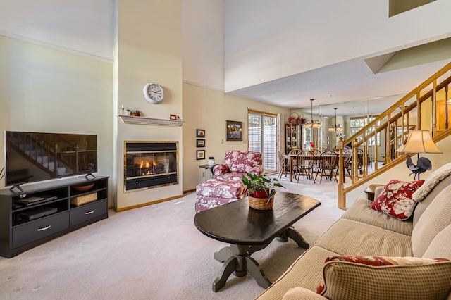 living room with light carpet and a towering ceiling