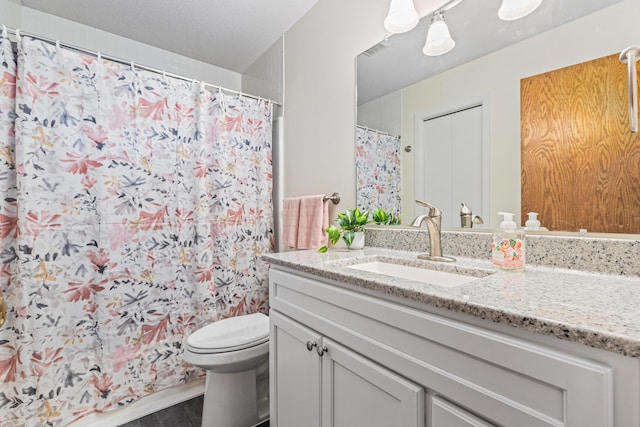 bathroom with vanity, toilet, and a shower with shower curtain