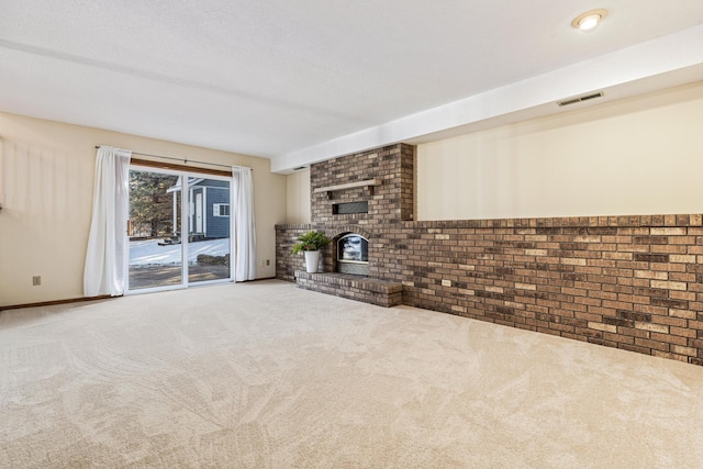 unfurnished living room featuring carpet