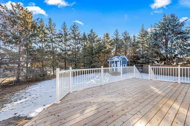 wooden terrace featuring a storage shed