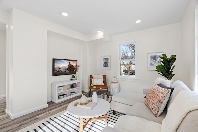 living room with light hardwood / wood-style flooring