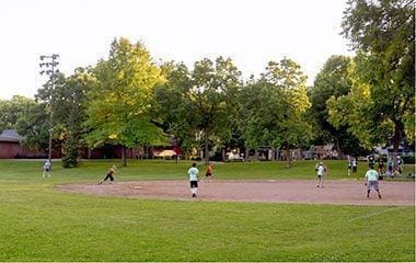 view of property's community with a yard