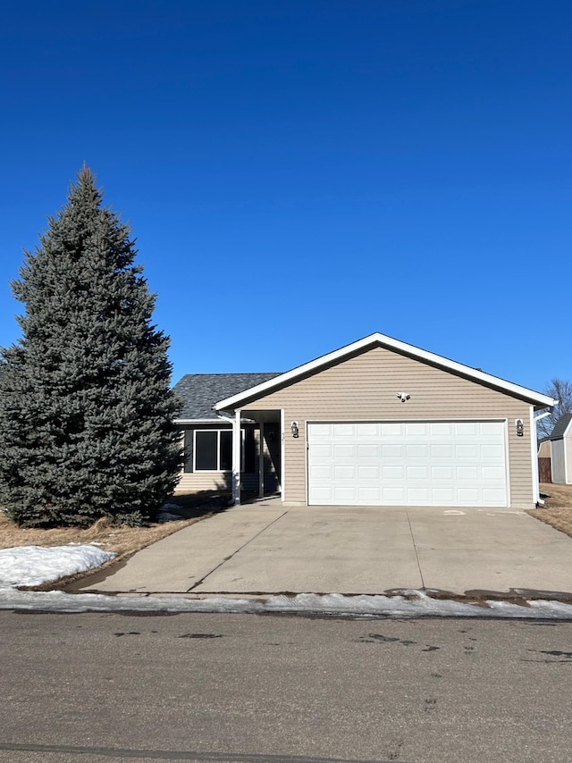 single story home featuring a garage