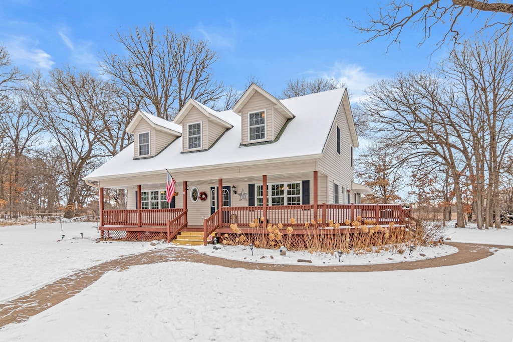 cape cod home with a porch