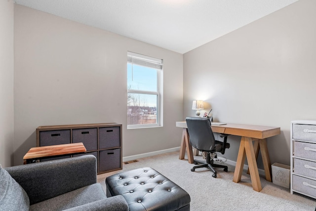 carpeted office space with lofted ceiling