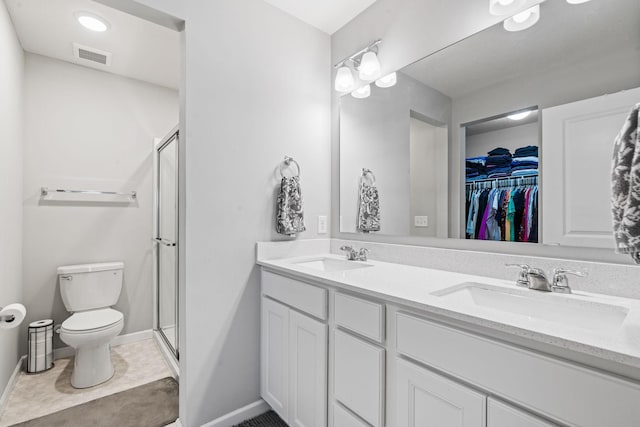 bathroom with walk in shower, vanity, toilet, and tile patterned flooring