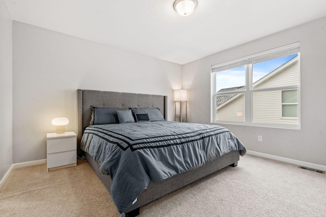 bedroom with light carpet