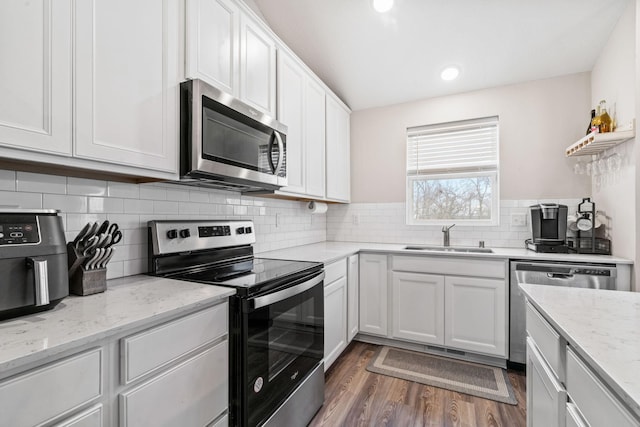 kitchen featuring white cabinetry, sink, and stainless steel appliances