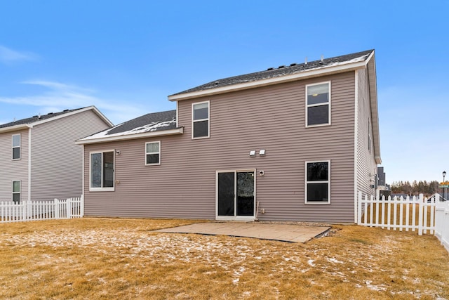 back of property featuring a yard and a patio area