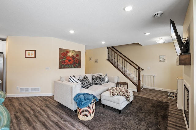 living room with dark hardwood / wood-style floors