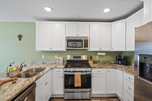 kitchen featuring white cabinetry, sink, and stainless steel appliances