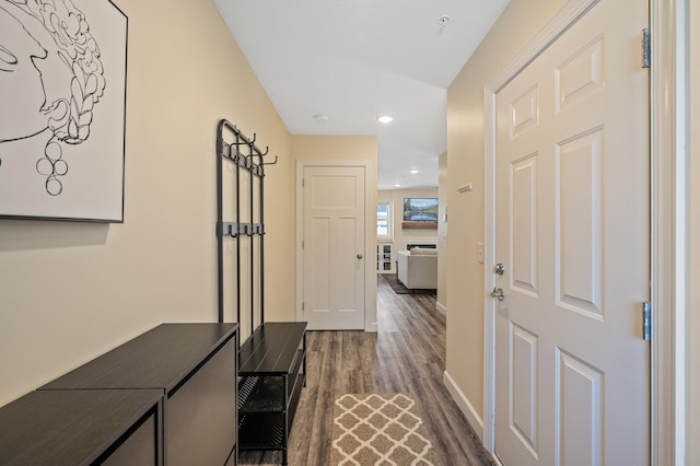 hallway with dark hardwood / wood-style floors