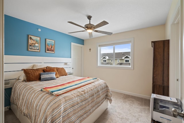 bedroom with ceiling fan and carpet flooring