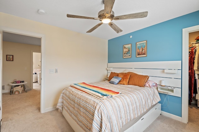 carpeted bedroom featuring ceiling fan and a closet