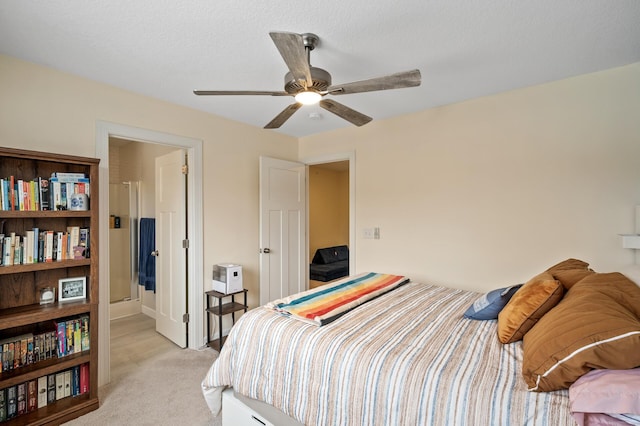 bedroom with light carpet, a textured ceiling, and ceiling fan