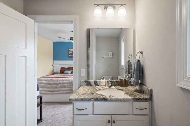 bathroom featuring ceiling fan, vanity, and toilet