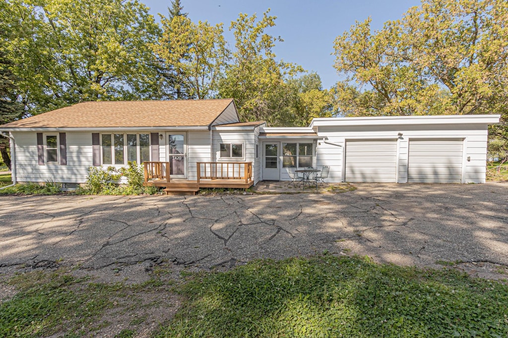 back of house featuring a garage