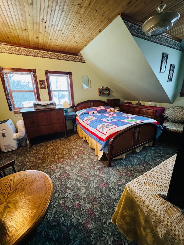 bedroom with lofted ceiling, wood ceiling, and carpet